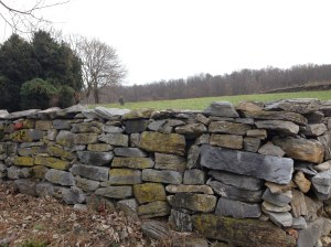 rock wall and gravestone